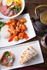 Asian lunch served on a wooden table