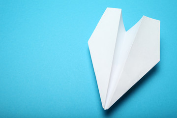 White paper origami aircraft concept. Copy space for text.