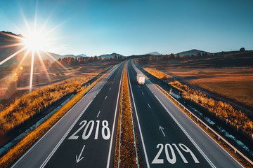 Driving on open road at beautiful sunny day from 2018 to new year 2018