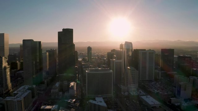 4k aerial drone footage - City of Denver Colorado at sunset.  Rocky Mountains on the horizon.
