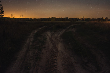 The road from the field on a starry night