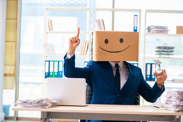 Happy man with box instead of his head