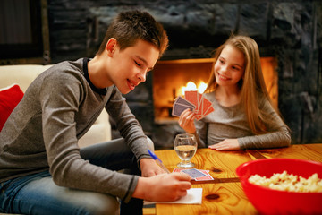 Kids playing card game at home