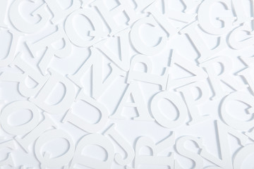  White wooden alphabet letters top view on white background