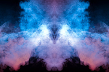 Background of blue and pink wavy smoke in the form of a ghost's head close-up on a black isolated ground. Abstract pattern of steam from vape.