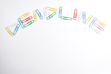 The word DEADLINE written with colored paper clips.