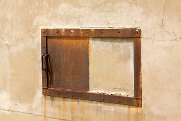 metal device on the broken wall