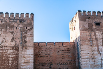 View of outer wall of tower of fortress in Alhambra, Granada