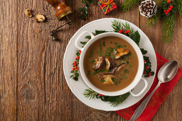 Traditional mushroom soup, made from porcini mushrooms. Christmas decoration.