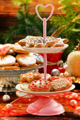 Christmas gingerbreads cookies on wooden table