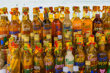 Arranged rum bottles on a local market in Sainte-Anne, Grande-Terre, Guadeloupe