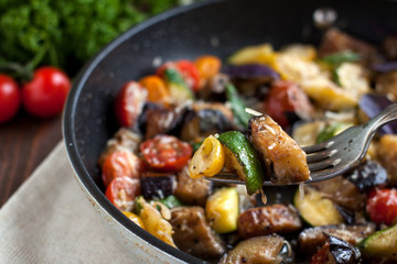 Vegetable bake from zucchini, eggplants, cherry tomatoes
