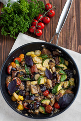 Vegetable bake from zucchini, eggplants, cherry tomatoes