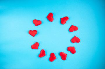 February 14th background concept. White textile hearts on a blue background, the concept of love for Valentine's Day