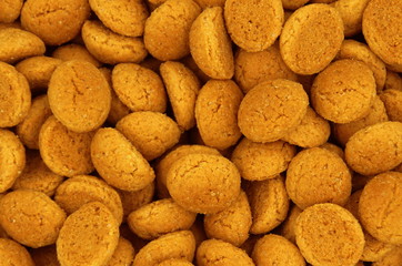 Background of Pepernoten, typical traditional Dutch cookie-like treat, associated with the early December Sinterklaas holiday in the Netherlands and Belgium.