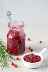 Cowberry sauce with rosemary and coconut sugar. Cranberry confiture. Spicy berry jam to meat, turkey. Autoimmune Paleo. Diet healthy food concept. Cereals Gluten Dairy free. Copy space.