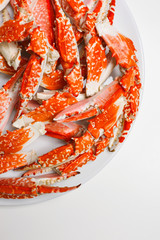 Crab legs on plate from above © mahony