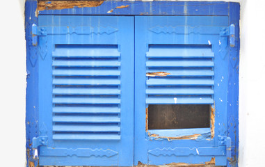 Weathered window with shutters