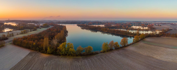 Panoramic landscape with quarry lakes near Speyer in Germany.