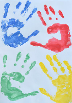 Children's drawing: multi colored prints of children hands. Friendship concept
