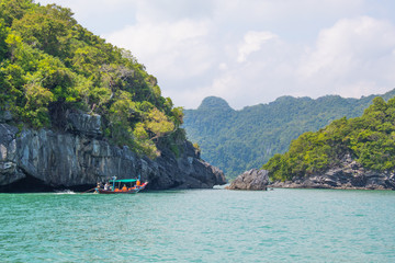 tropical island in the sea with boat