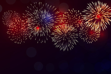 colorful fireworks vector on dark blue background with sparking bokehs