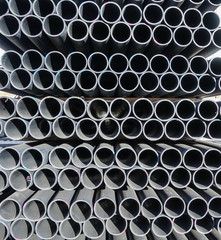 Plastic pipes in stock of finished products stacked in packs