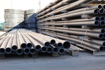 Plastic pipes in stock of finished products stacked in packs