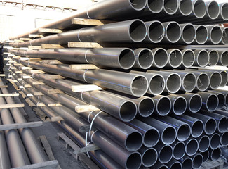 Plastic pipes in stock of finished products stacked in packs