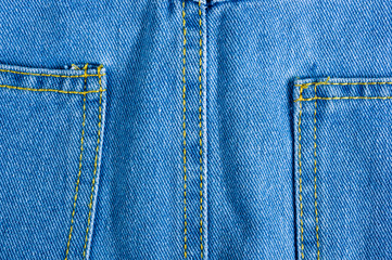 Blue washed faded jeans texture with seams