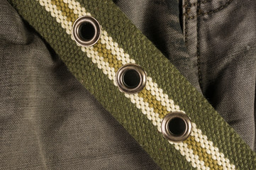 clothing items washed cotton fabric texture with seams, clasps, buttons and rivets