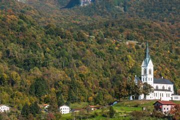 Picturesque church on hill top in Dreznica, SLovenia at autumn