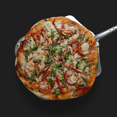 Appetizing pizza on a shovel on a dark background. Classic feed.
