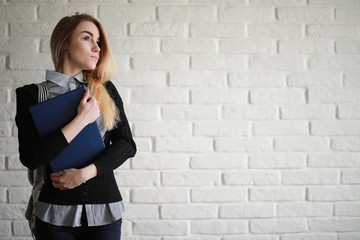 Young pretty blonde girl student