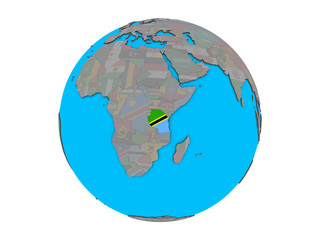 Tanzania with embedded national flag on blue political 3D globe. 3D illustration isolated on white background.