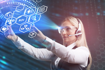 Business, Technology, Internet and network concept. Young businessman working on a virtual screen of the future and sees the inscription: ROI.