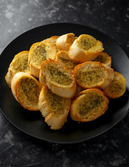 Fresh Garlic Bread bread, toast on black plate