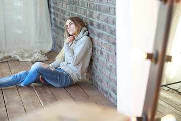 A young girl rests in a cozy room