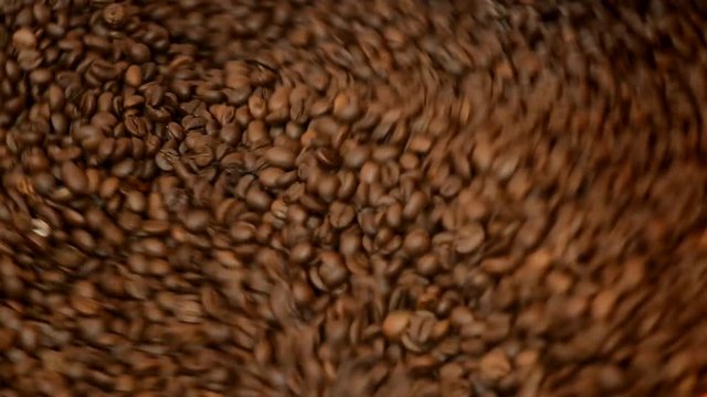 coffee grains rotate in a roaster, coffee roasting