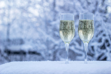 glass of champagne on on winter background