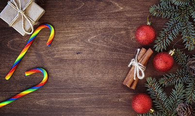 New Year's background. Spruce branches on a wooden table. Ornaments for the New Year tree. Christmas concept.
