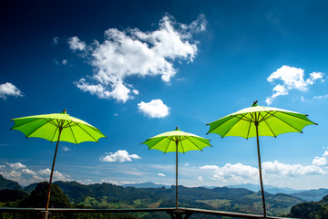 Colorful umbrella with blue sky.