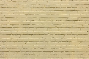 Pale yellow brick wall