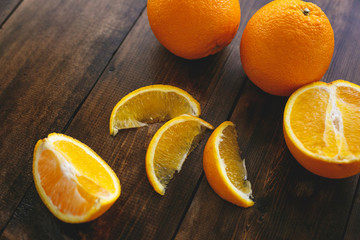 Oranges lie on a table made of natural wood. Healthy Eating