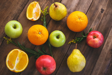 Colorful fruit on a table made of wood. Top view