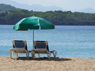 deck chairs on the beach overlooking the ocean