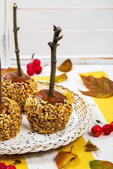 Caramel Apples on Wooden Background. Selective focus.