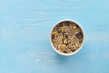 Breakfast seeds on light blue wooden table