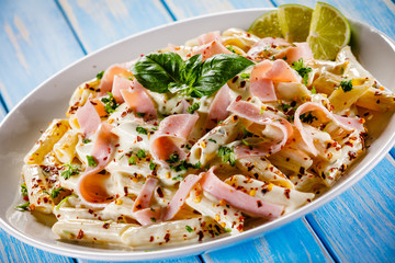 Pasta carbonara on wooden table