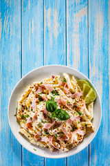 Pasta carbonara on wooden table